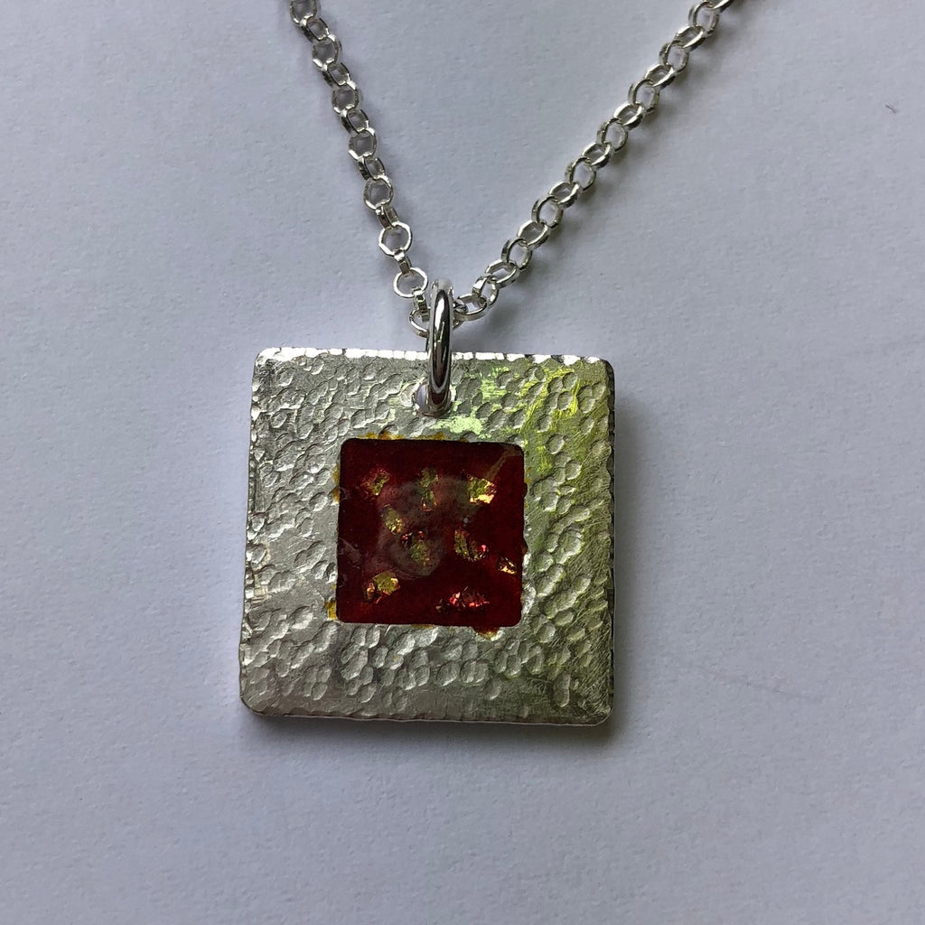 pendant, hammered fine silver with red enamel and fine gold detail